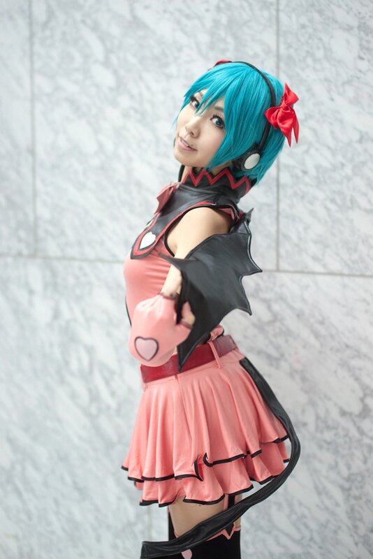 cosplayer in pink and black outfit