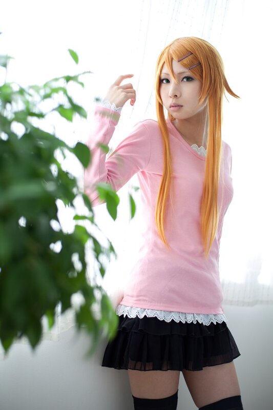 cosplayer in pink and black outfit