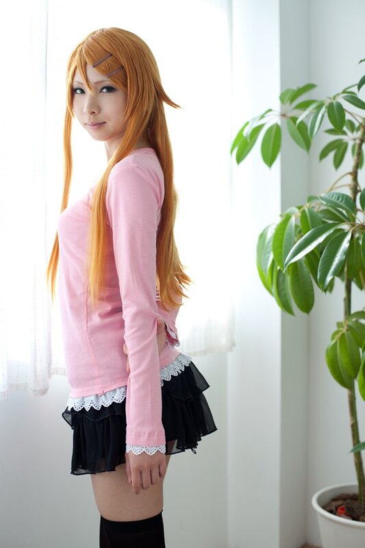 cosplayer in pink and black outfit