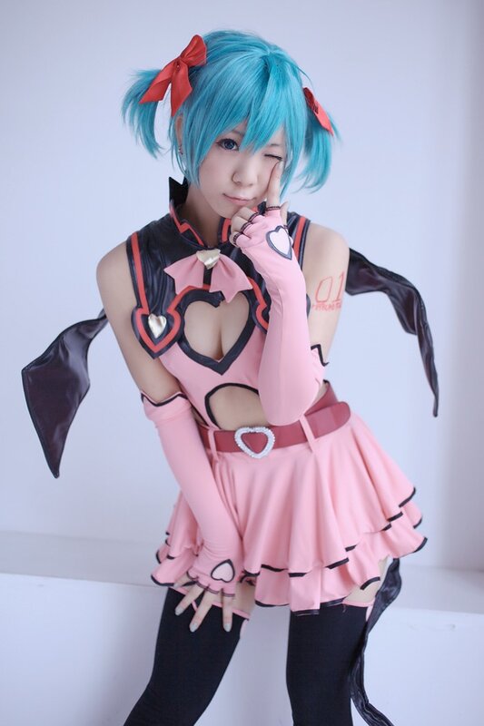 cosplayer in pink and blue costume