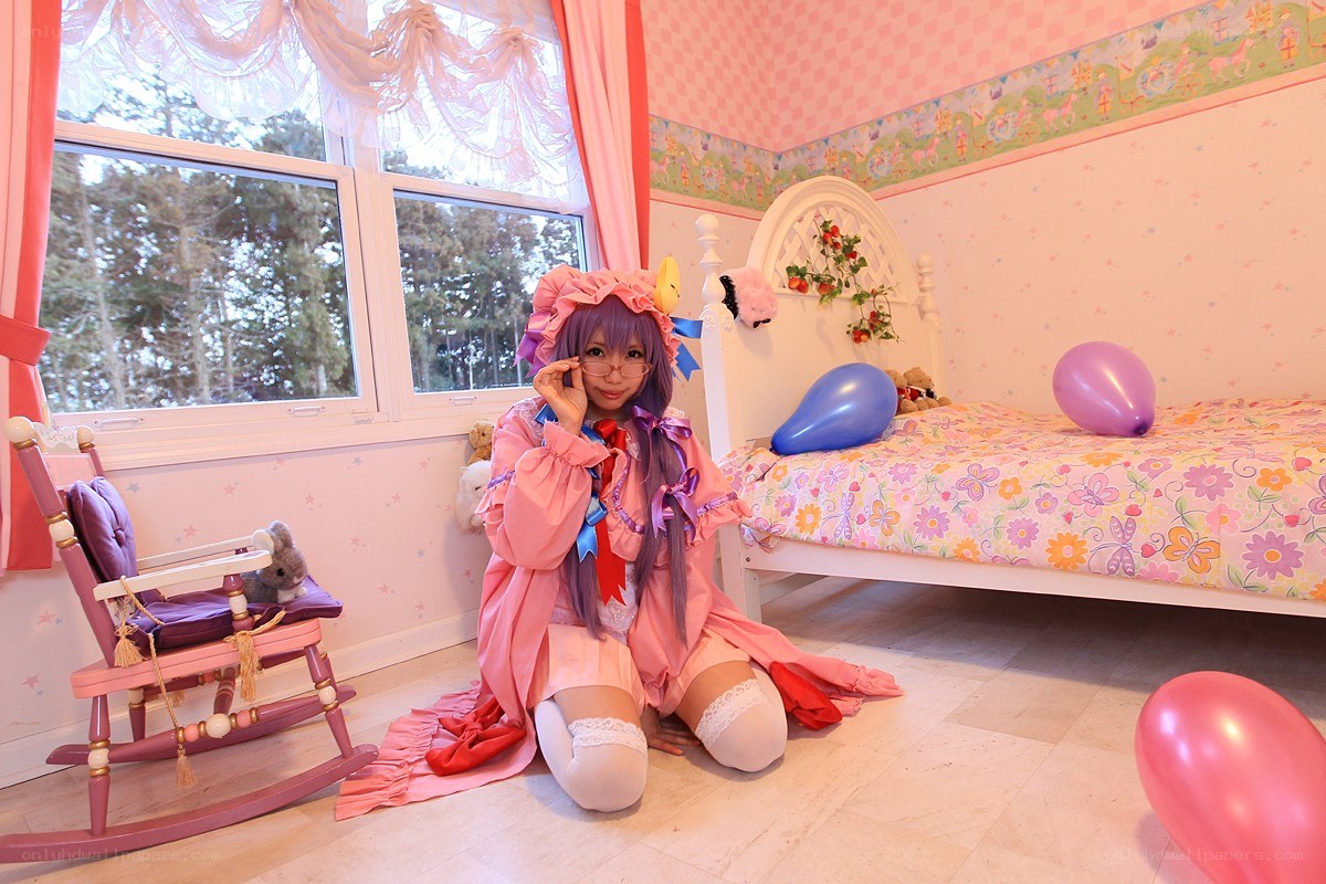 Cosplayer in pink bedroom