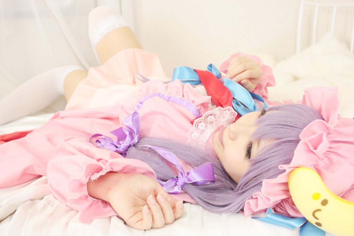 cosplayer in pink dress lying down