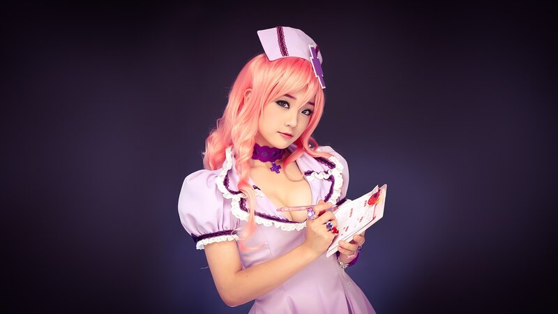 cosplayer in pink nurse outfit