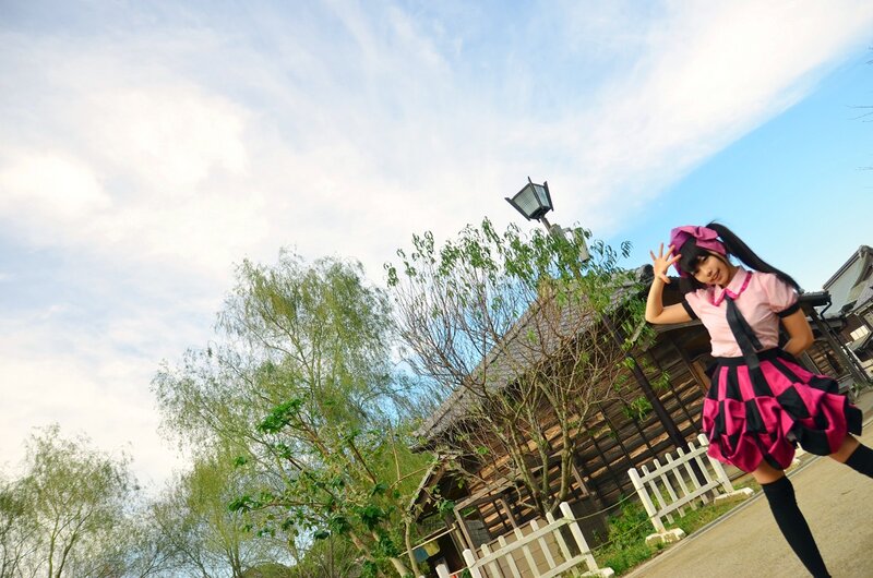 Cosplayer in pink outfit outdoors