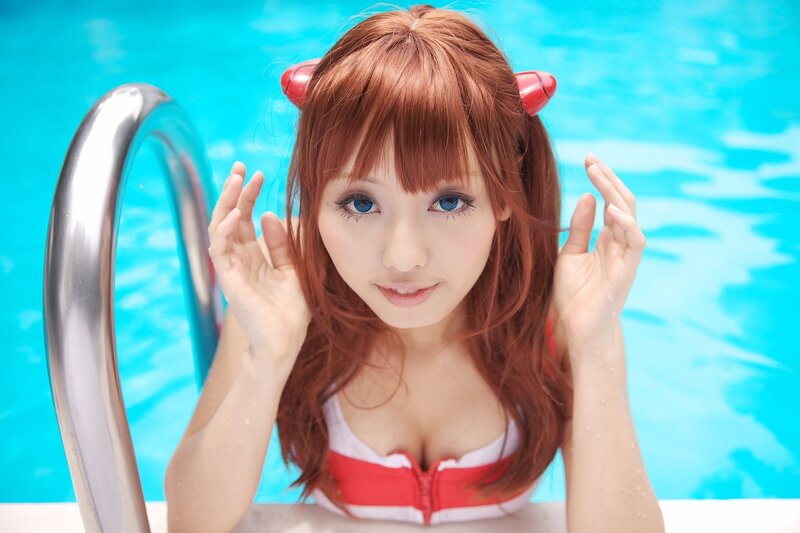 cosplayer in pool with devil horns