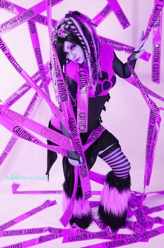 cosplayer in purple and black costume