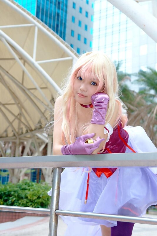 cosplayer in purple and white costume