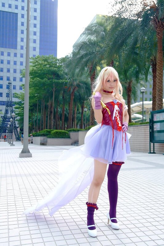 cosplayer in purple and white costume