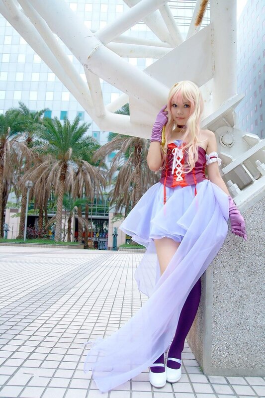cosplayer in purple and white costume