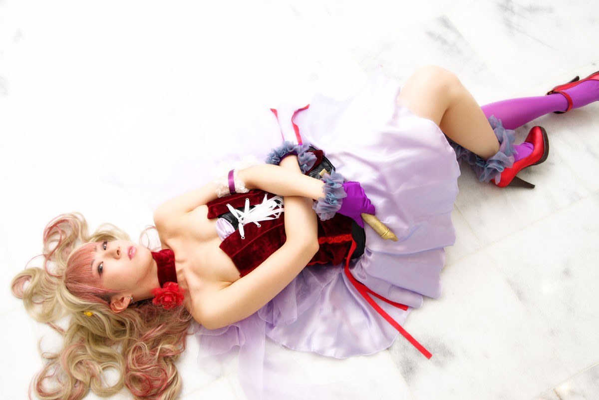 cosplayer in purple dress lying down