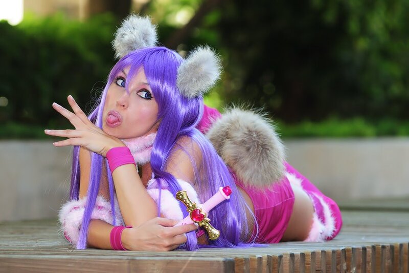 cosplayer in purple wig and pink costume