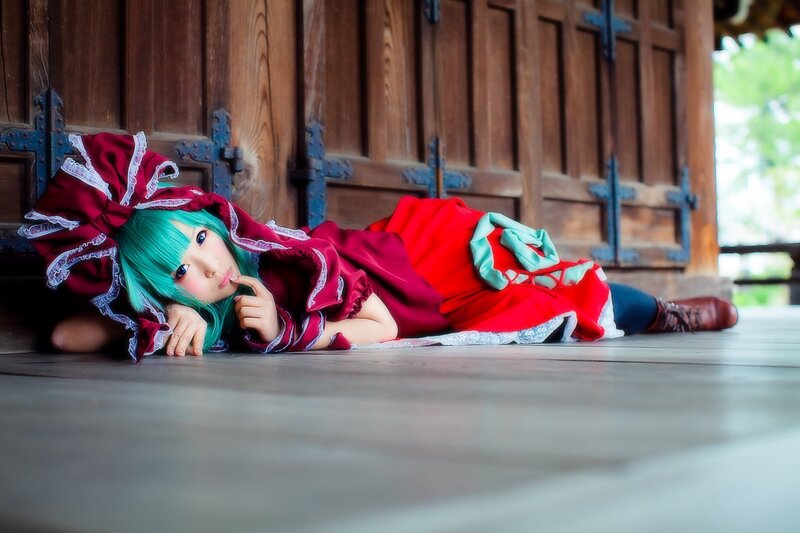 cosplayer in red dress lying down