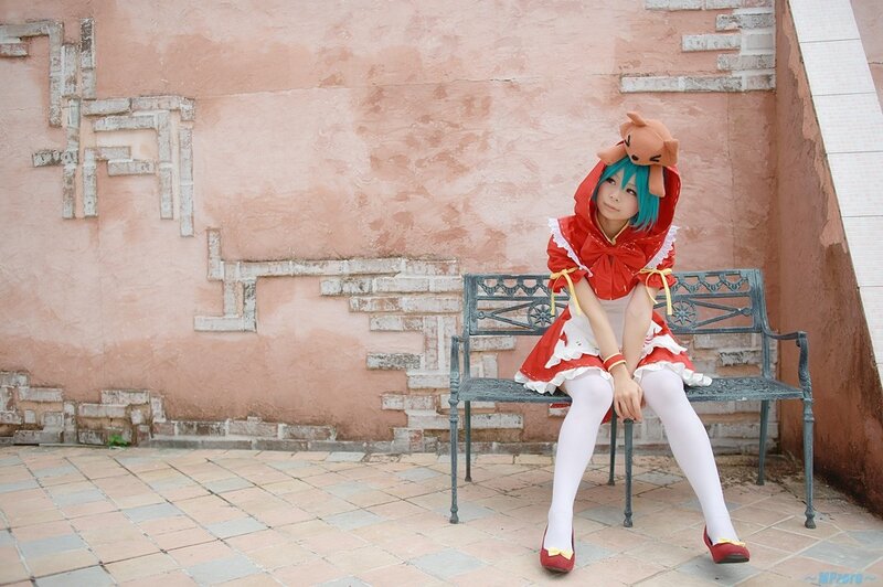 cosplayer in red dress on bench