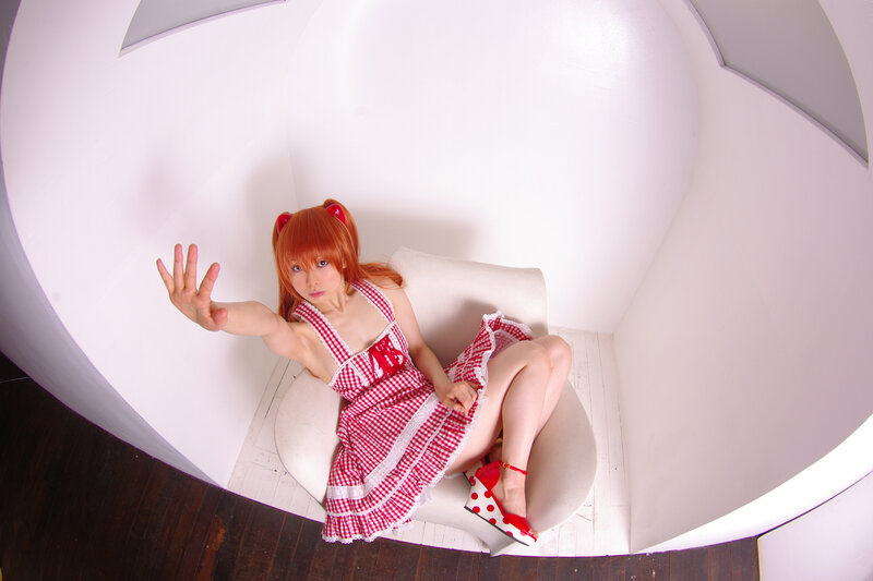 cosplayer in red dress sitting
