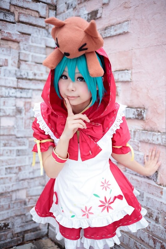 cosplayer in red dress with animal hat