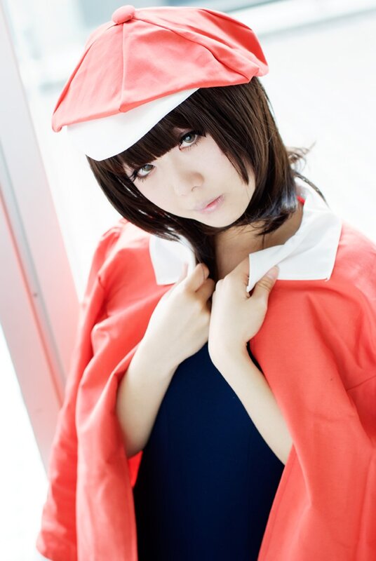 cosplayer in red hat and coat