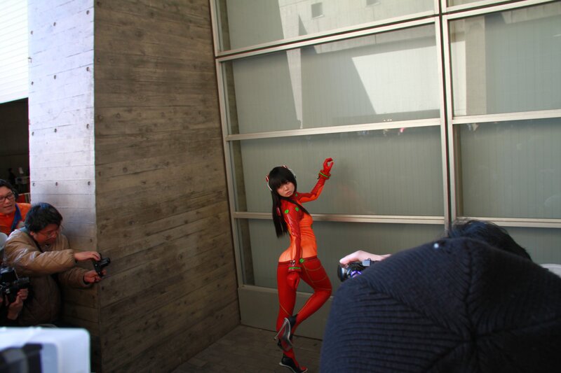 cosplayer in red suit poses