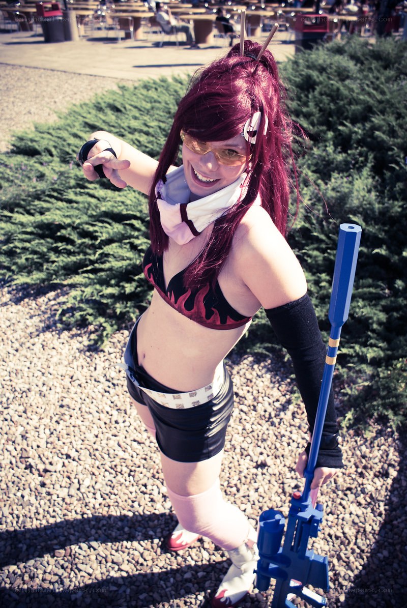 cosplayer in red wig and goggles