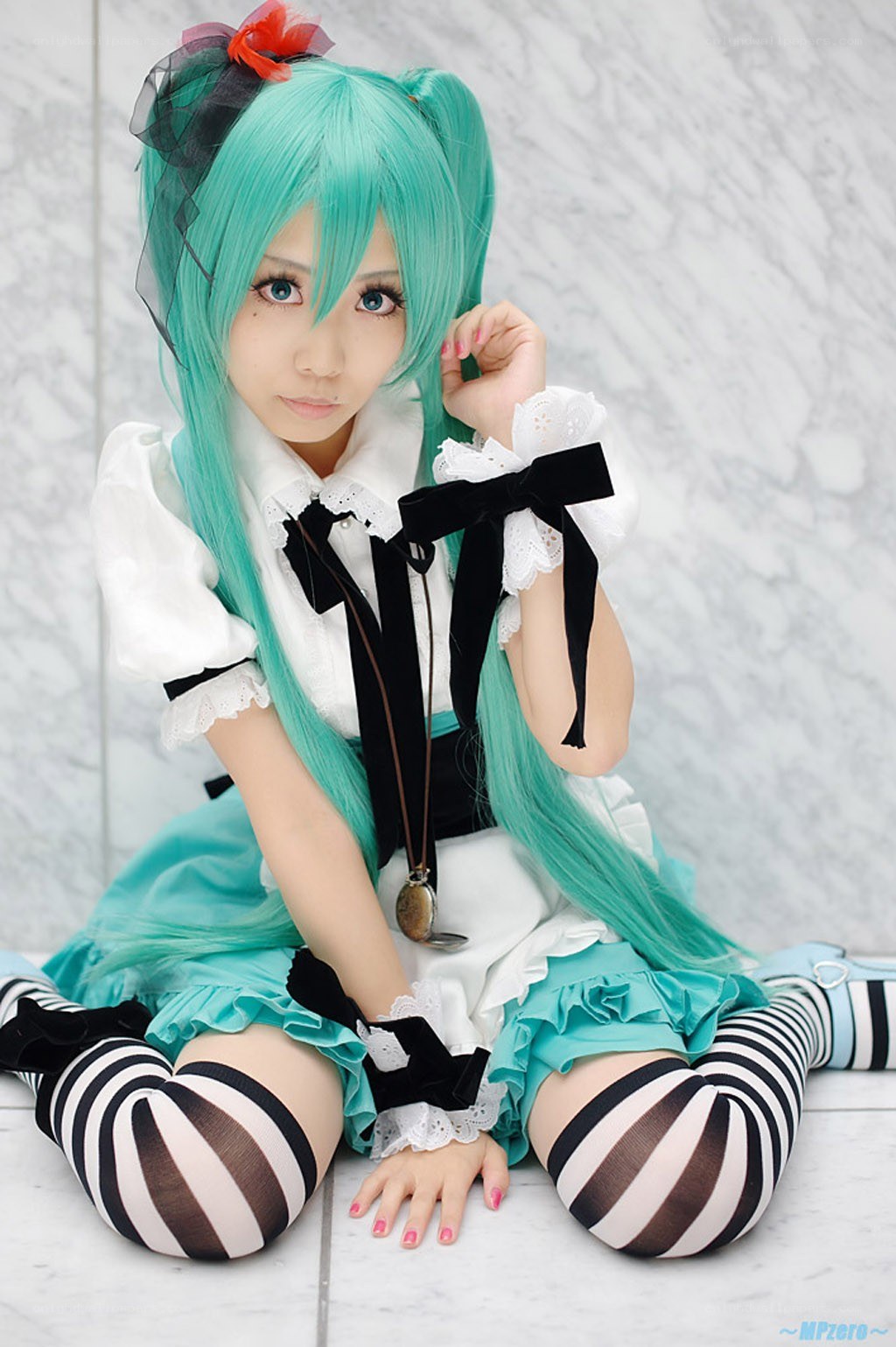 cosplayer in turquoise outfit