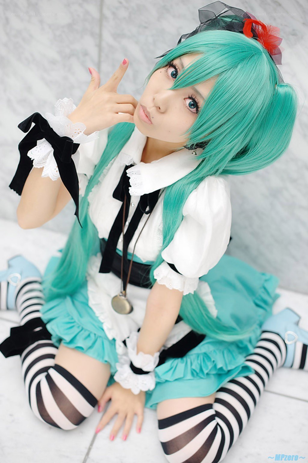 cosplayer in turquoise outfit