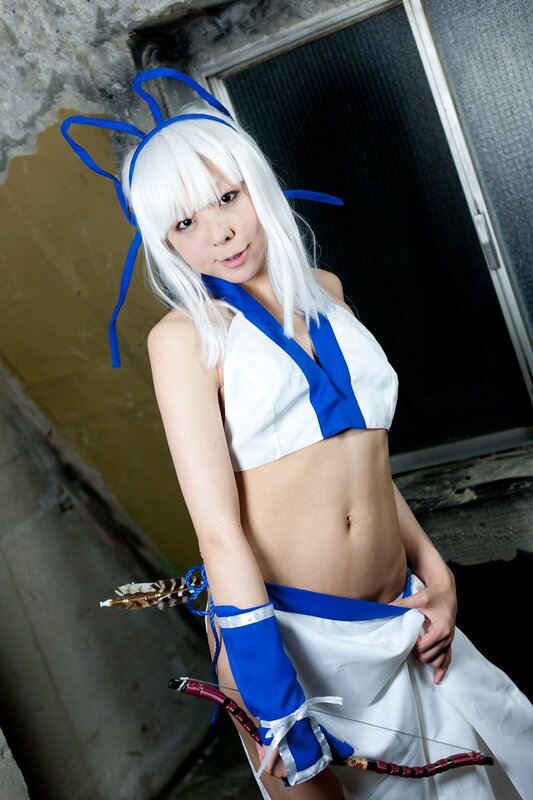 cosplayer in white and blue costume