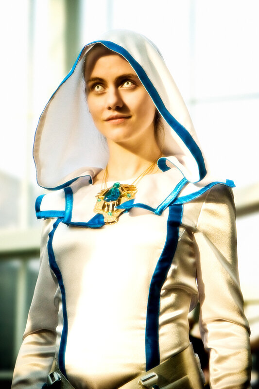 cosplayer in white and blue hooded outfit