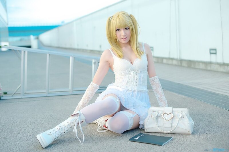 cosplayer in white dress sitting