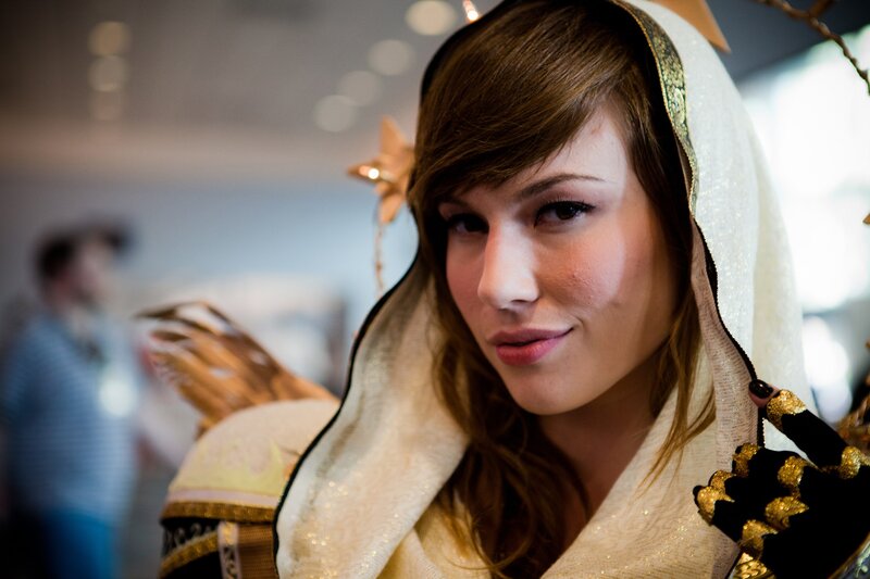 cosplayer in white hooded costume