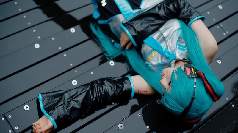 cosplayer lying on deck