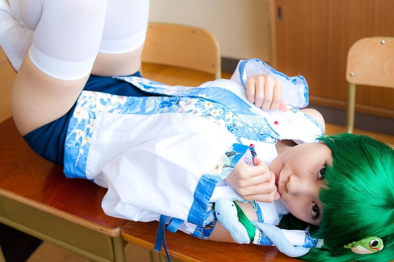 cosplayer lying on desk