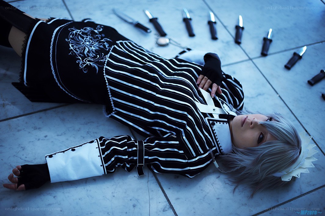 cosplayer lying on floor with knives