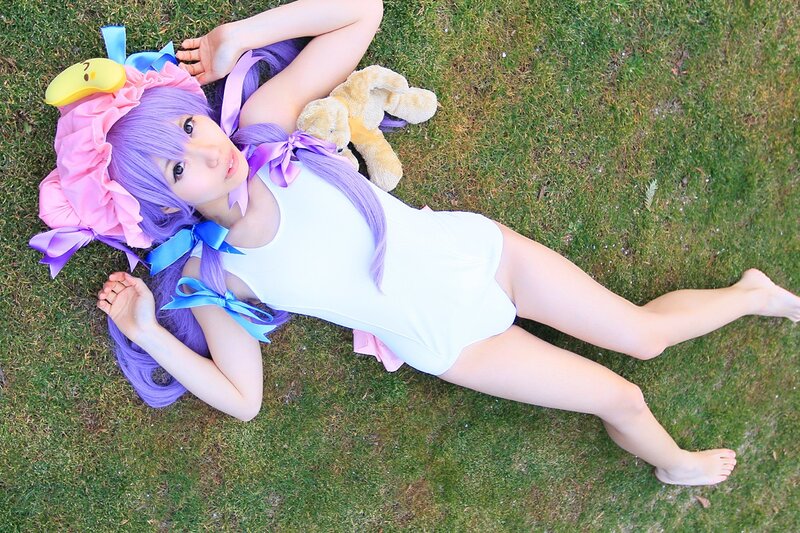 cosplayer lying on grass
