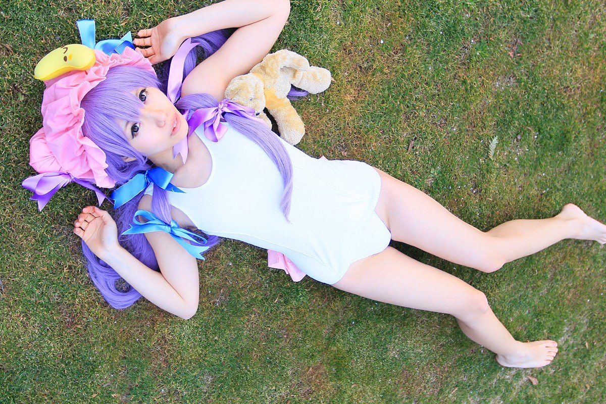 cosplayer lying on grass