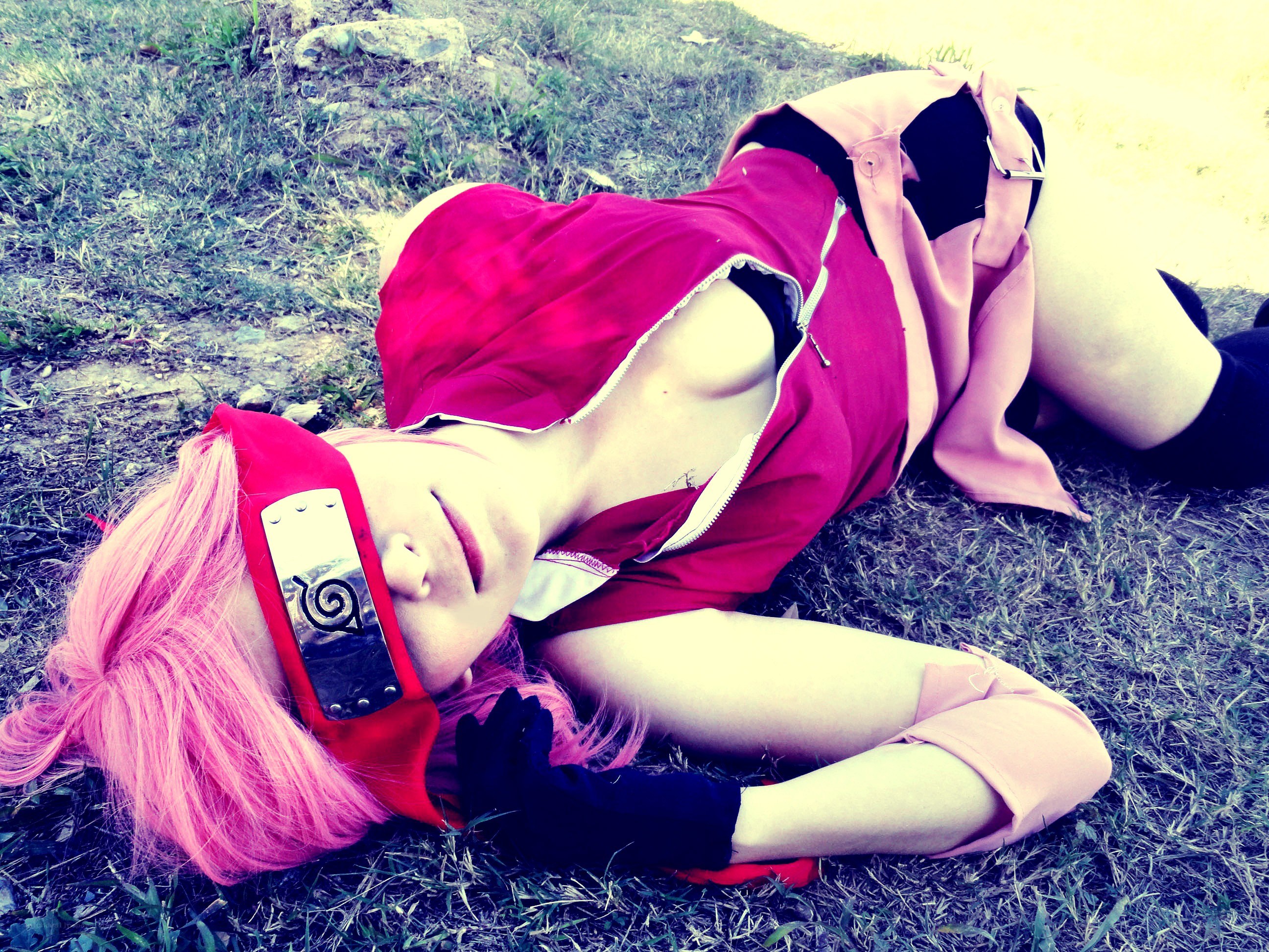 cosplayer lying on grass