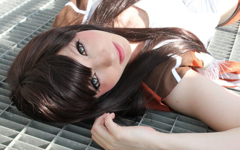cosplayer lying on grate