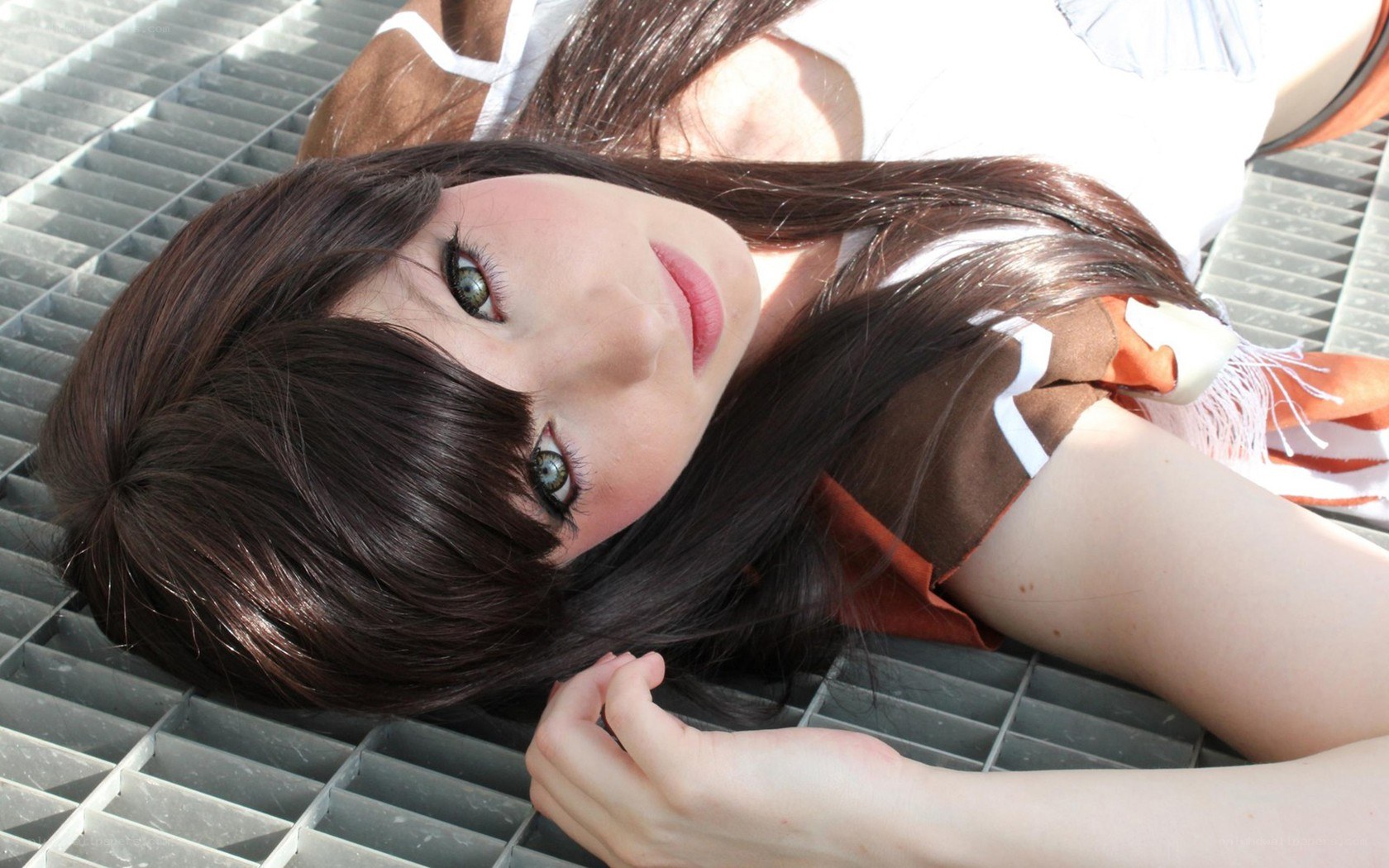 cosplayer lying on grate