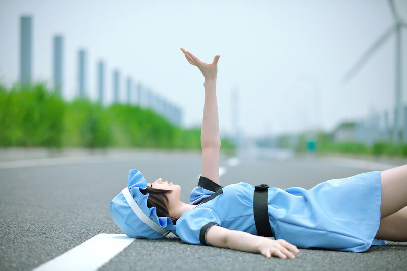 cosplayer lying on road