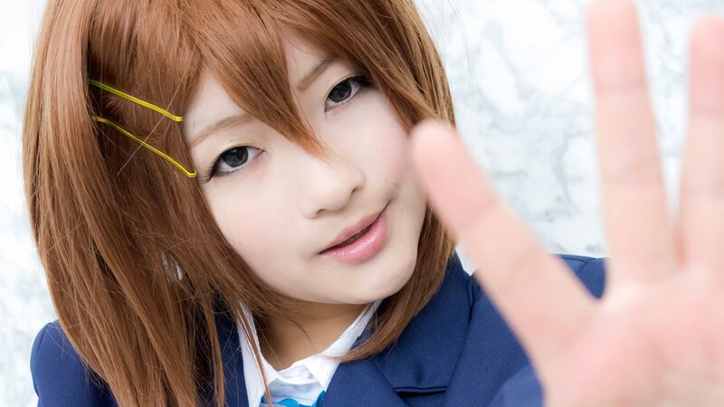 cosplayer making hand gesture