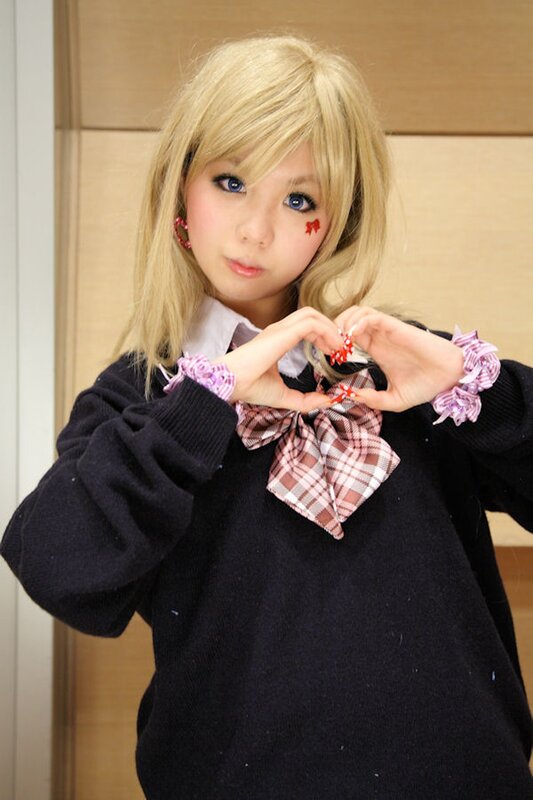 cosplayer making heart gesture