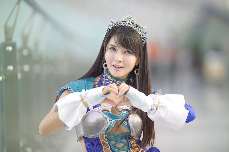 cosplayer making heart gesture