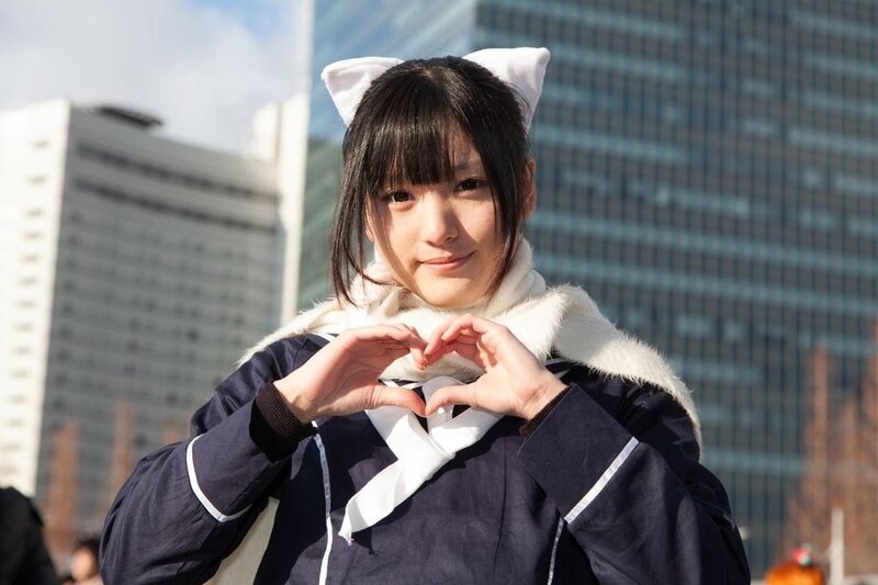 cosplayer making heart gesture