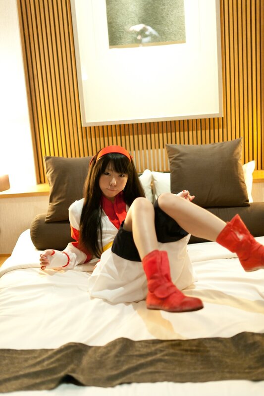 cosplayer on a bed