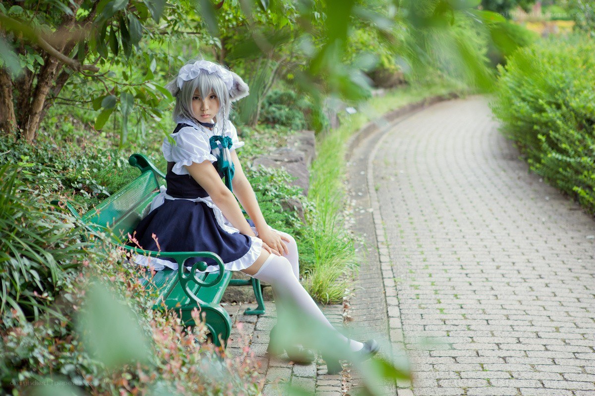 cosplayer on a park bench