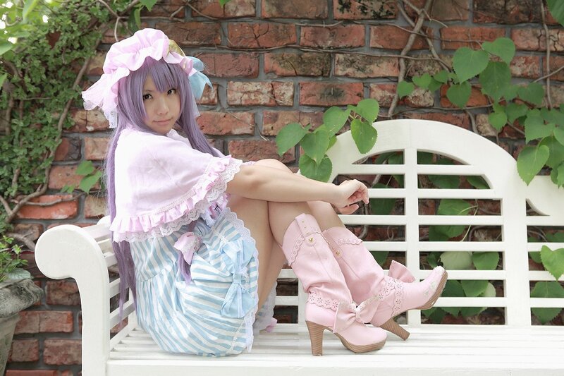 Cosplayer on a white bench