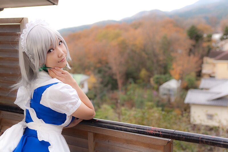 cosplayer on balcony with autumn view