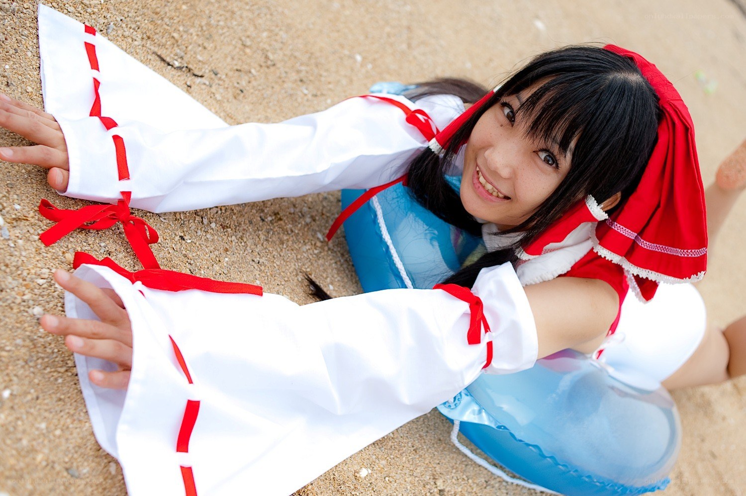 cosplayer on beach in costume