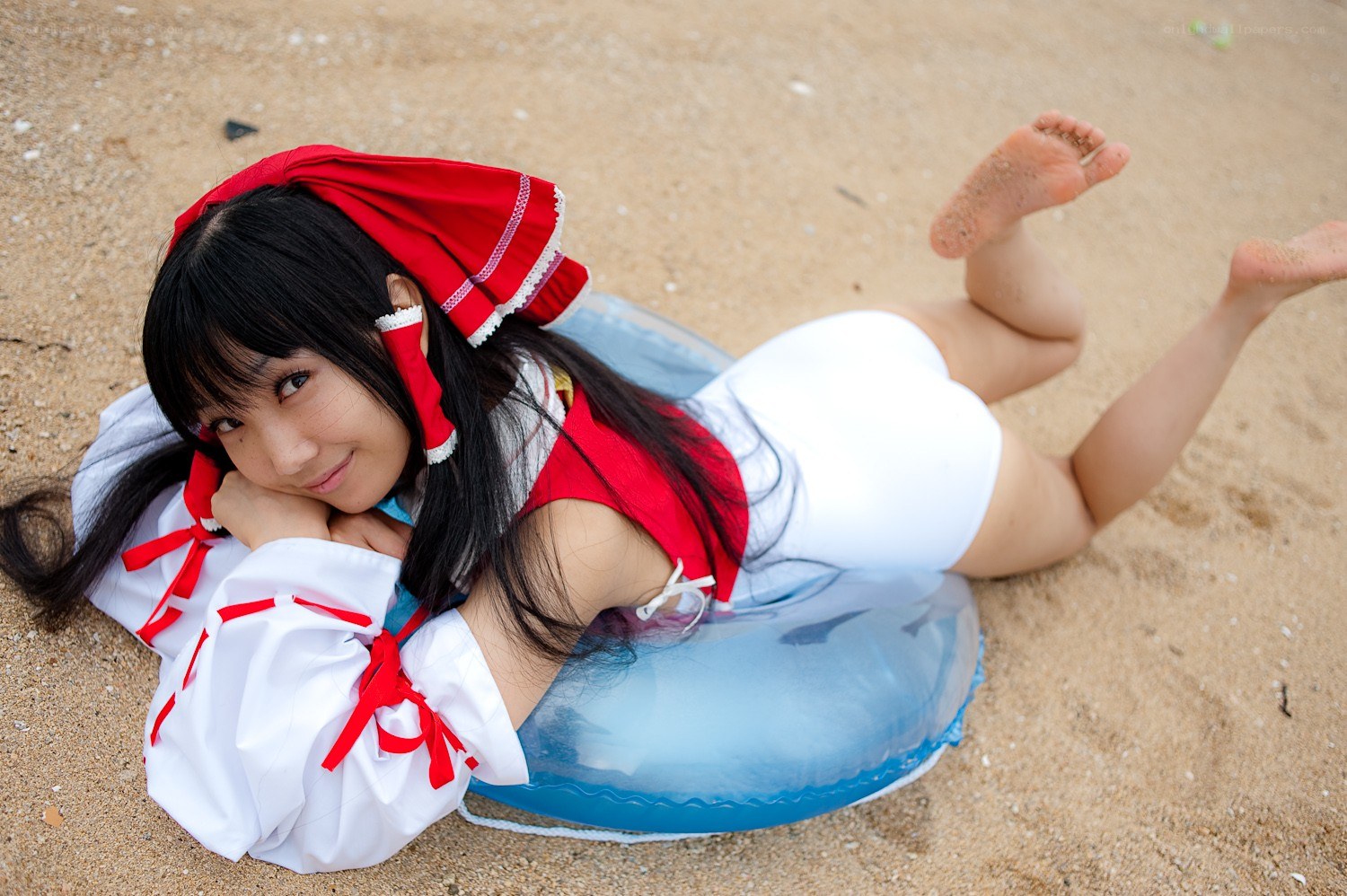 cosplayer on beach with floatie