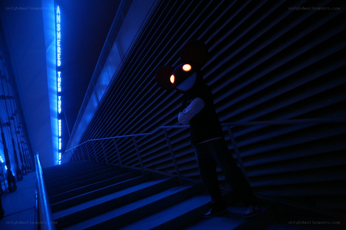 cosplayer on blue-lit stairs