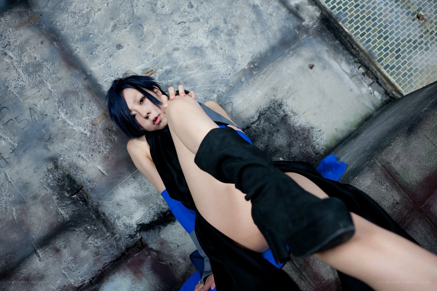 cosplayer on concrete ground