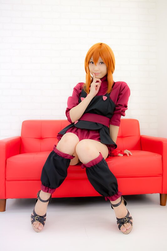 cosplayer on red couch